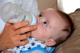 A baby drinks formula from a bottle. Pic: Pixabay.