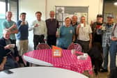 Members at the Tuesday afternoon social session raise a toast to the success of the Shed.