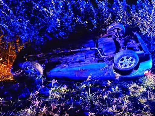 The car overturned into a ditch (Beds Fire and Rescue service)