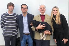 Tom with family members, including dog Nelson