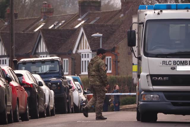 "This image shows a bomb disposal operative walking back to his van having made an initial inspection." Photo: Harry Adam.