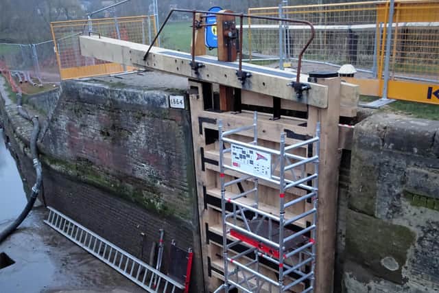 Fitting the bottom gates at Leighton Lock PHOTO: Tim Casterton