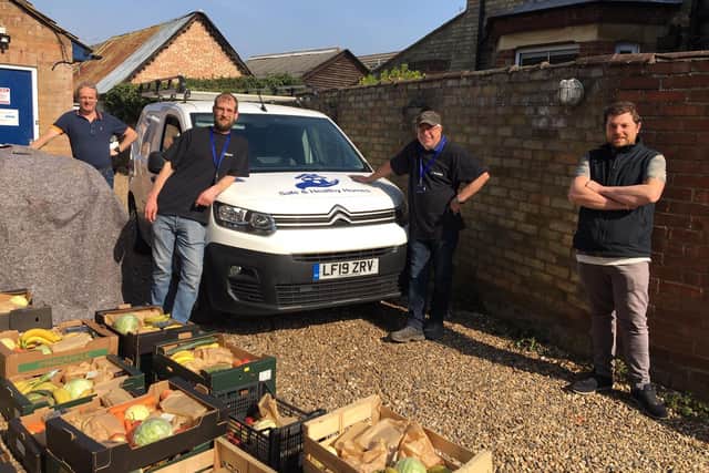Left to right: James Morris and his team Stuart Bachelor and Paul Worlock, with Darren Eastgate who has the veg stall on the market