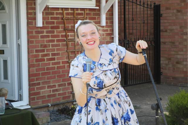 Fiona has been keeping her neighbours' spirits up by singing on her driveway