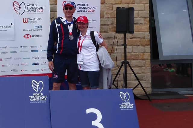 Nick with his bronze World Transplant Games discus medal and proud wife, Anna.