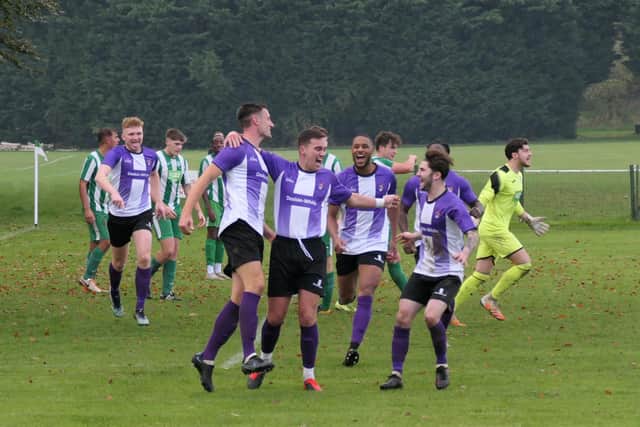 Leighton Town players celebrate one of their eight goals  (Picture by Andrew Parker)
