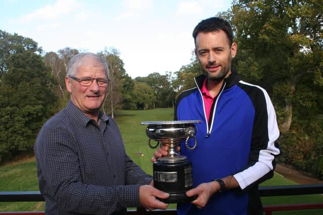Captain Keith Edmunds presents the Sandhouse Society Aggregate trophy to winner Colin Aitken
