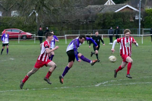 Tom Bryant unleashes his shot to score for Leighton Town against Totternhoe in the Gladwish Challenge Trophy on Saturday  Picture by Andrew Parker