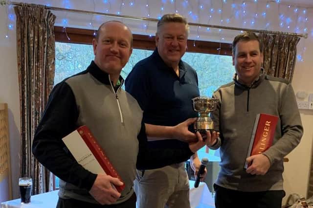 Christmas foursomes winners Stuart McLeod and Justin Moss receive their prizes from Leighton Captain Simon Rossiter.