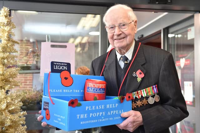 Wally Randall selling poppies in Wilko. Photo: Jane Russell.