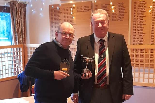 Barney Hallam winner David Evans (left) receives his trophy from retiring Seniors Captain Denis Leitch