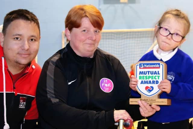 Lizzie Jackson with her Nationwide Mutual Respect Award from Team England.