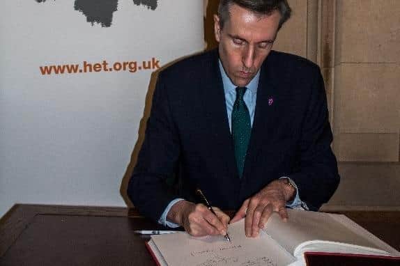Andrew Selous MP signs the Holocaust Educational Trust’s Book of Commitment.