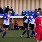 Captain Alfie Osborne celebrates as players mob Ross Adams, scorer of their third goal  Picture by Andrew Parker