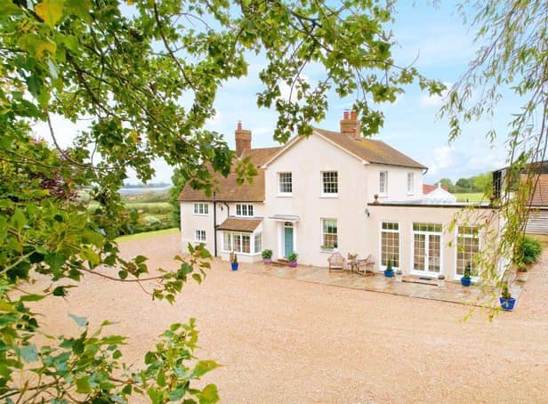 This period five bedroom former farmhouse with a detached one bedroom annexe, offers outbuildings including stables and workshops, a double carport and over 10 acres of grounds with panoramic countryside views