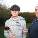 Leighton Buzzard Golf Club's Junior Captain George Stephenson with dad Adrian and the engraved golf clubs