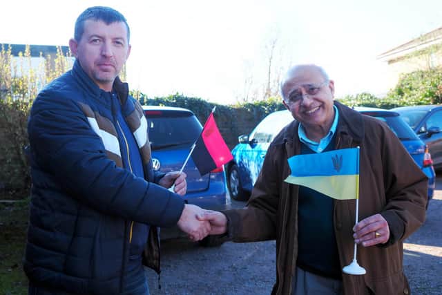 Mykhaylo and Deputy Lord-Lieutenant Bedfordshire Vinod Tailor with flags, the black and red being for Western Ukraine. Photo: Tony Margiocchi.