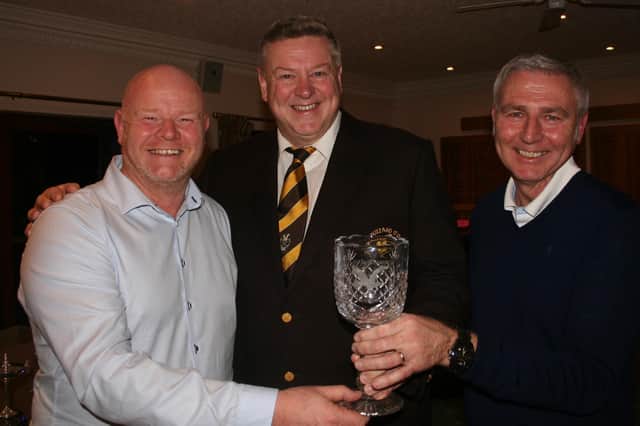 Darren Valentine and Graham Freer receiving the trophy from Immediate Past Captain Simon Rossiter