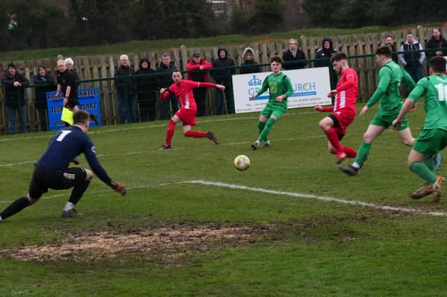 Joe Fitzgerald crosses for Luke Pyman in Leighton Town’s 2-0 defeat by Tring Athletic on Saturday    Picture by Andrew Parker