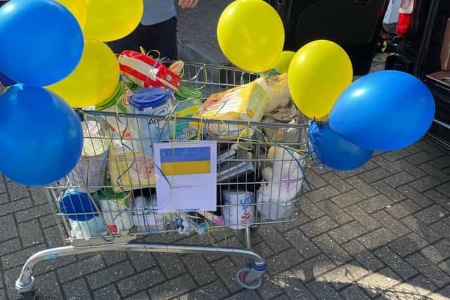 A trolley full of donations arrives.