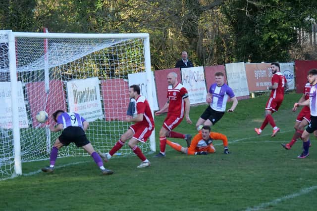 No.9 Abuzar Khan heads into the net to give Leighton the lead in their 1-1 draw with Risborough Rangers at the BEP Stadium on Saturday