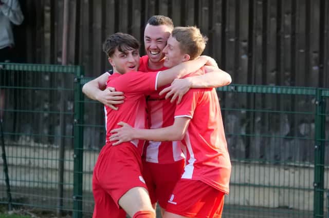 Abu Khan, scorer Joe Fitzgerald and Josh Hatton celebrating in the Oxhey Jets game PICTURE BY ANDREW PARKER