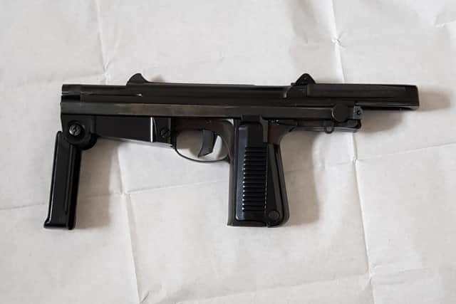 A long-barreled machine gun seized from Lake Street this morning