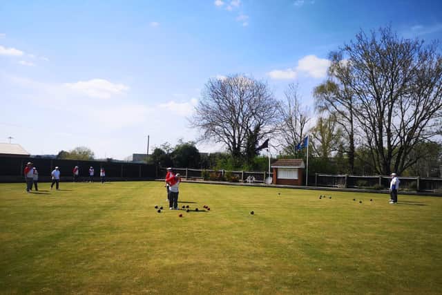 Bowlers enjoying being back on the green at the start of the club's centenary year