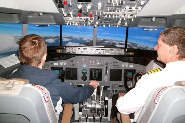 Mark Lowen with a customer in the Boeing 737 simulator.