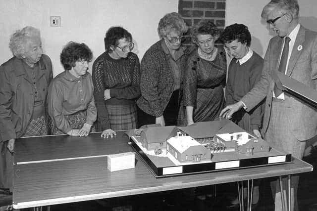 Dr Wink White (founder) with model of hospice in 1991 (C) Keech Hospice Care