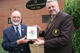 Paul Johnson presents the plaque to club captain Simon Rossiter