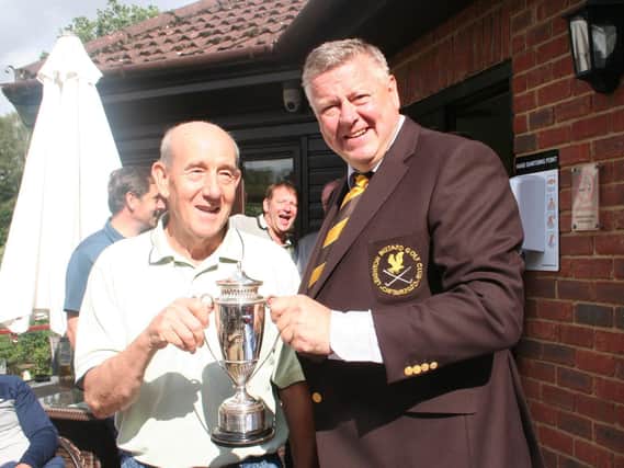 David Roberts being presented with Leighton Buzzard’s Wallis Cup by Club Captain Simon Rossiter