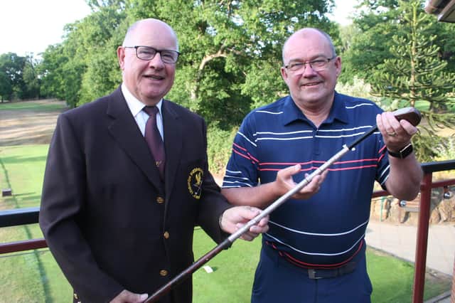 David Evans is presented with the President’s Putter by Trevor Stimpson.