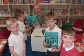 Olaf Falafel with Year 2 children collecting their signed copies of Blobfish