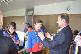 Rotary President Richard presenting “ Yes We Can” medals at BIGG
