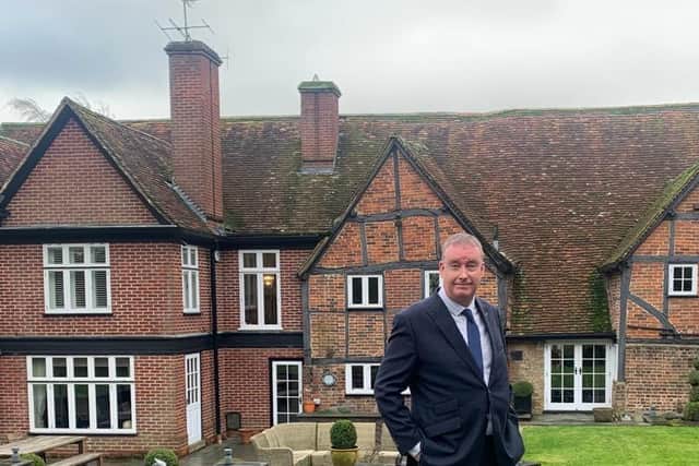 Simon Cartwright outside the 17th-century Grade II-listed home which features in the upcoming Monkhouse film. Picture: Simon Cartwright / SWNS