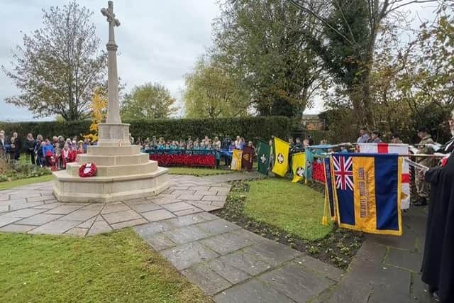 People gathered for the Linslade Garden of Remembrance service and wreath laying ceremony