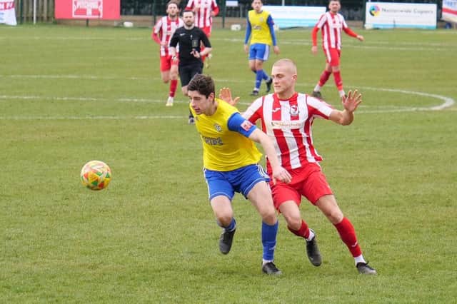 Action from Saturday's encounter with Hertford Town as Albie Hall puts pressure on. Photo: Andrew Parker.