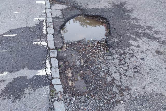 Urgent action is demanded to repair this deep pothole in Adastral Avenue, Leighton  Buzzard