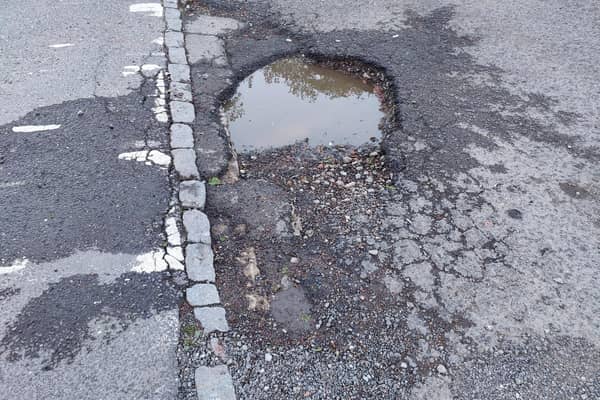 Urgent action is demanded to repair this deep pothole in Adastral Avenue, Leighton  Buzzard