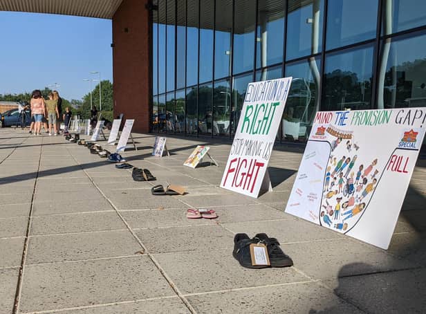 Protestors lined up pairs of shoes to represent each child without a SEND place