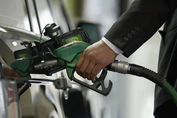 A customer fills his petrol tank at a BP petrol station (Photo by Toby Williams/Getty Images)