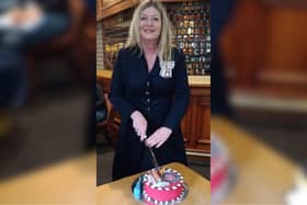 Susan Lousada, the HM Lord-Lieutenant for Bedfordshire cutting the special cake made by Sarah Miceli from "For Heaven's Cake"