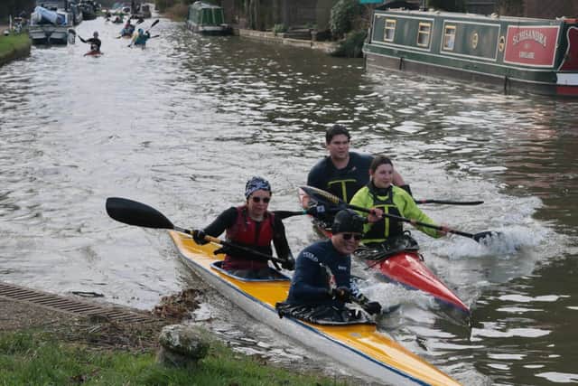 Adam Smith and Becky Greer with their Bishop's Stortford rivals at the Leighton Lock portage