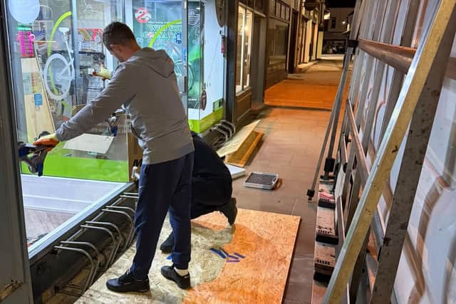 The new window being fitted at Allen's E-Bikes. Image supplied by: Dave Allen.