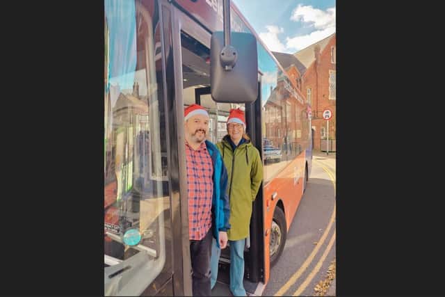 Town councillors Jo Symes and Andrea Kidd celebrating the free Christmas buses. Image: Leighton Buzzard Lib Dems.