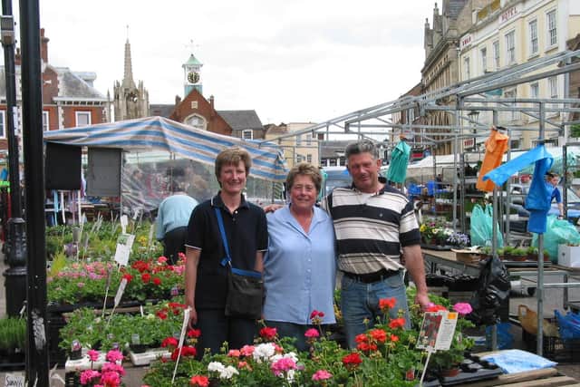 Mark and Karen Turner with their friend and colleague Joan Evans who ran the floristry side of the Leighton Buzzard market stall