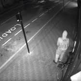 Image shows he burglar loitering around outside the premises before breaking in to steal the cash till