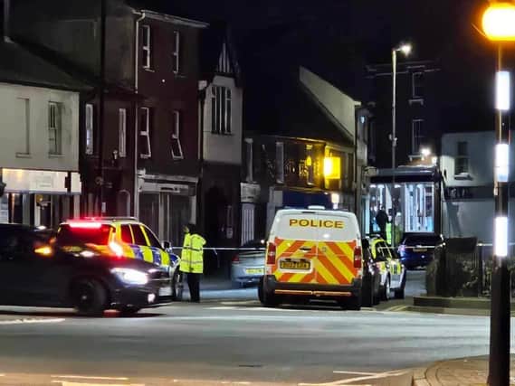 Police cordon and cars around the scene. Picture: Chris Keen