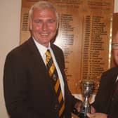 Graham Freer (left) receives his trophy from club president Trevor Stimpson.
